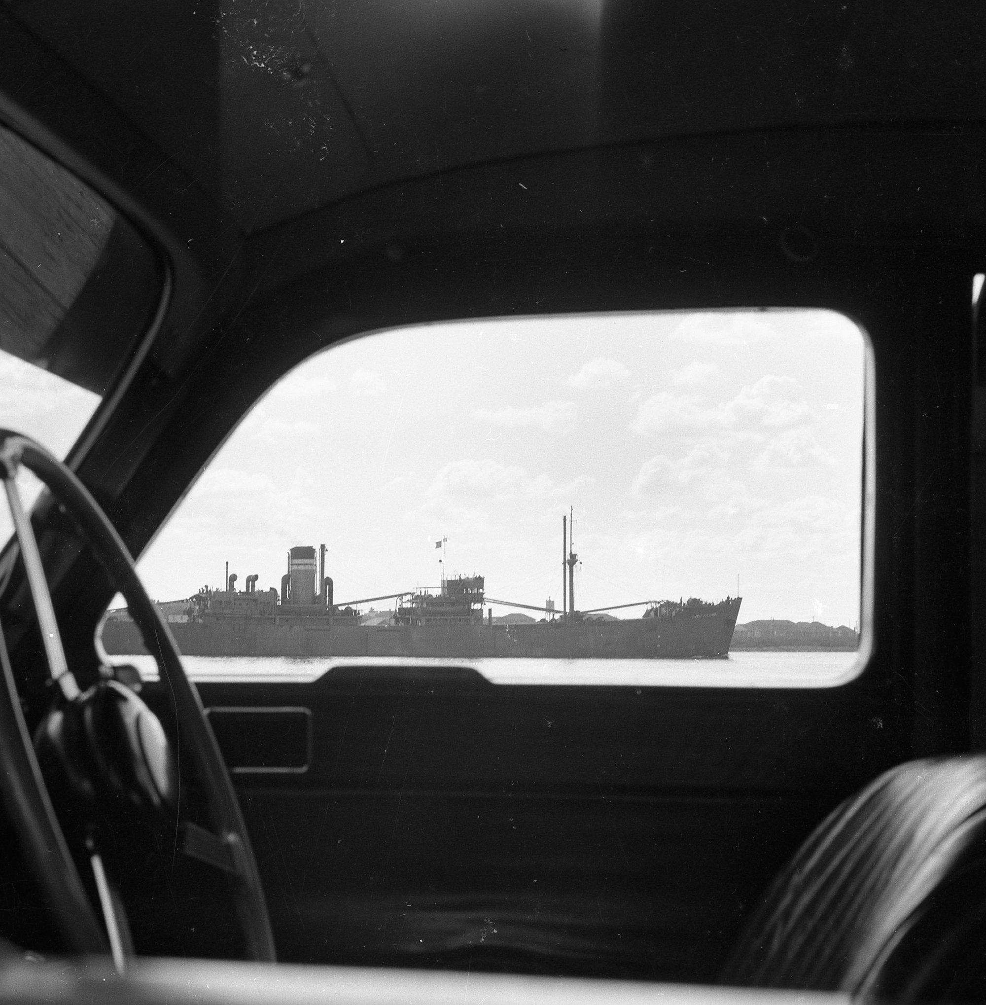 Photograph Taken Through A Car Window With Ship Going By Living Histories