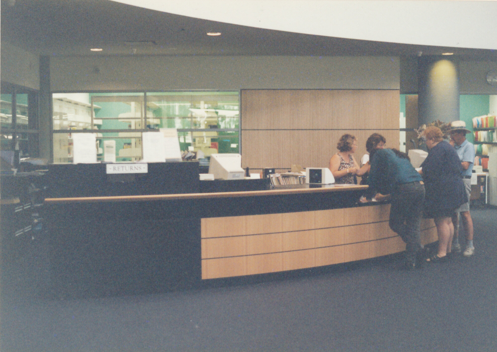 Loans desk, Central Coast Campus Library [1990s]. | Living Histories
