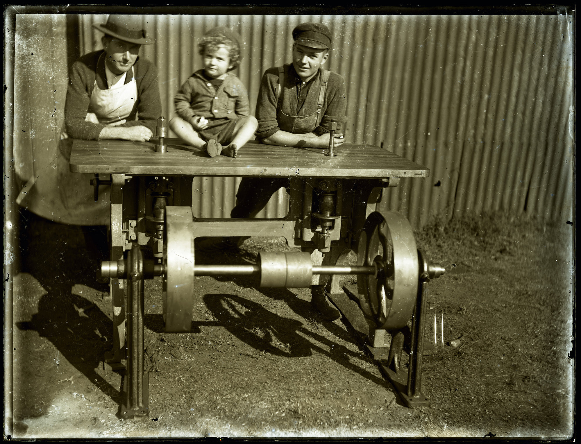 Two men and a child posing with machine apparatus, c1910s. | Living ...