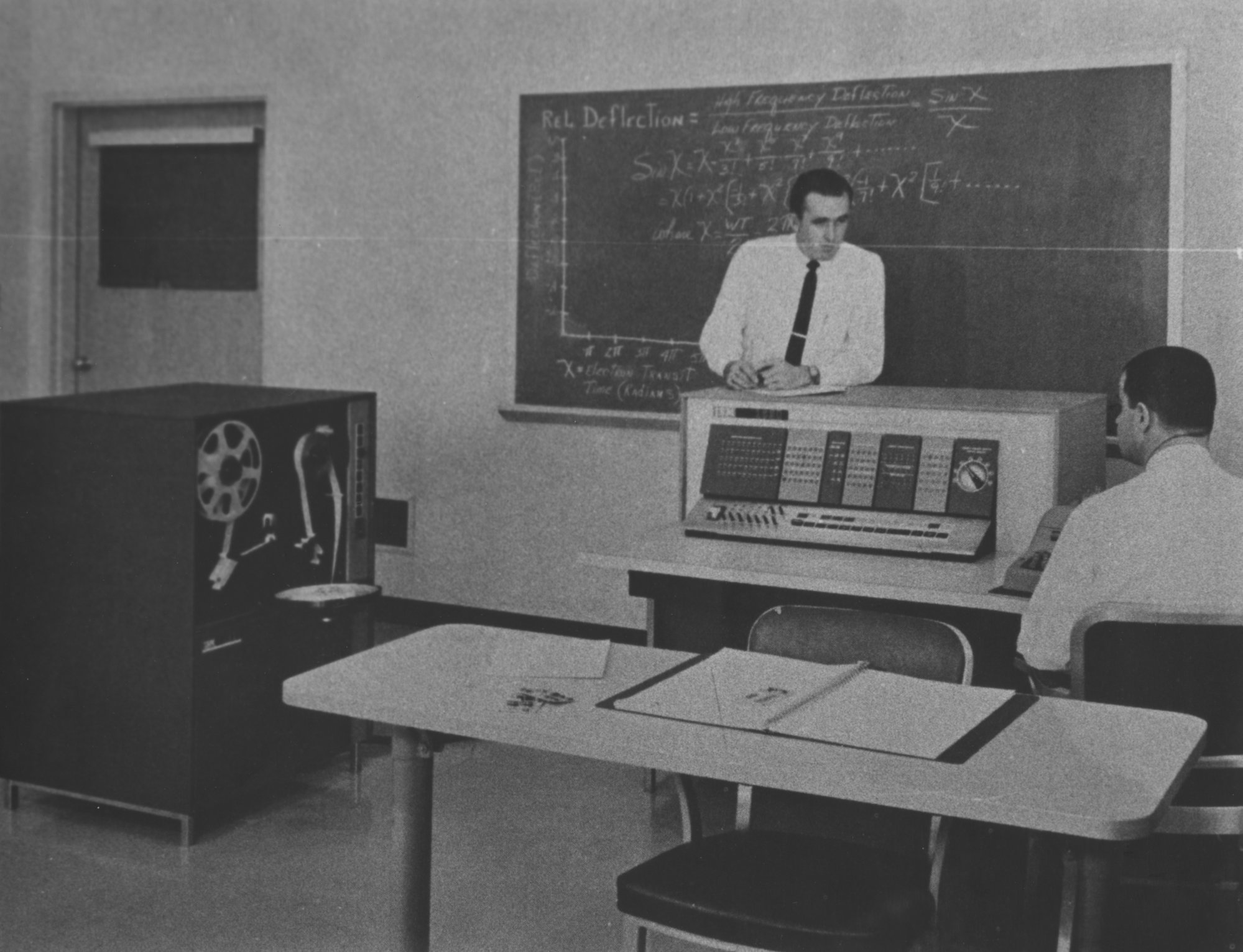 Two unidentified computer scientists in a computer laboratory with a ...