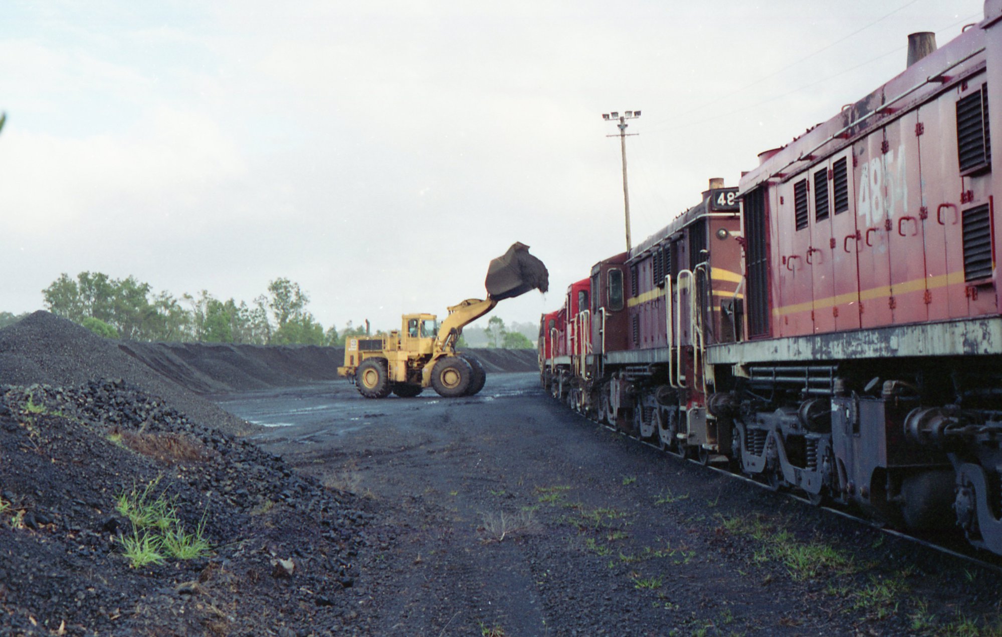 Front end loader loading a coal train at Branxton, NSW | Living Histories