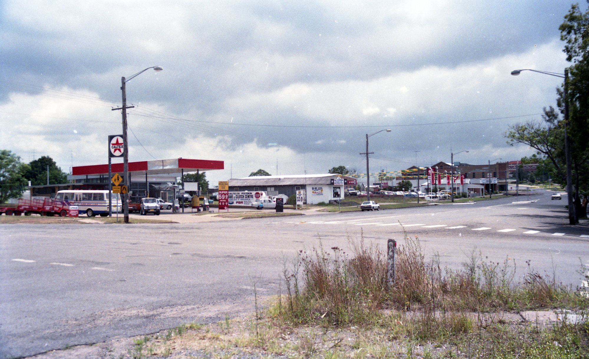Stormy sky over Fren's Holden car yard, Kurri Kurri, NSW, December 1987