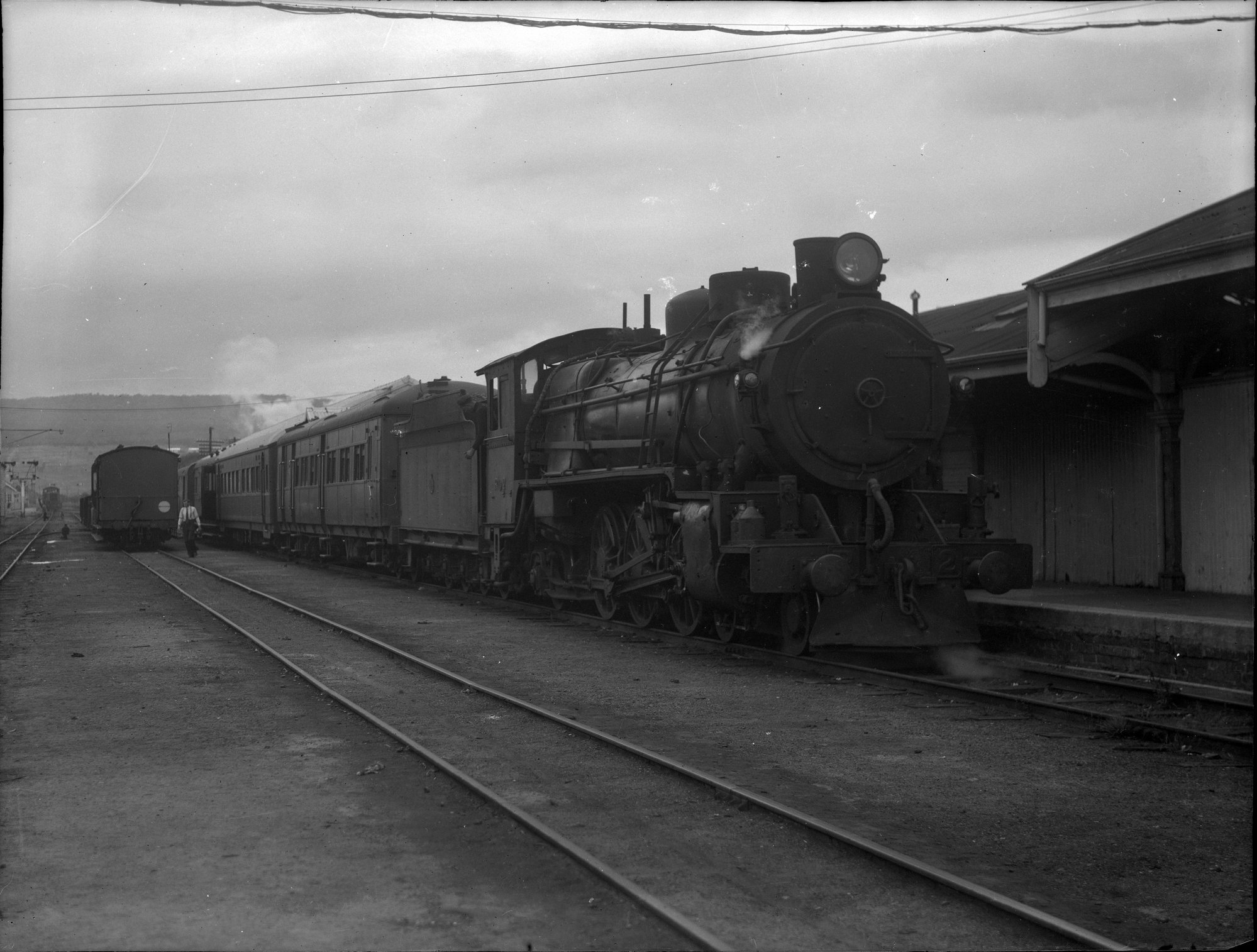 TGR R Class, no. 2, hauling passengers, at unidentified railway station ...