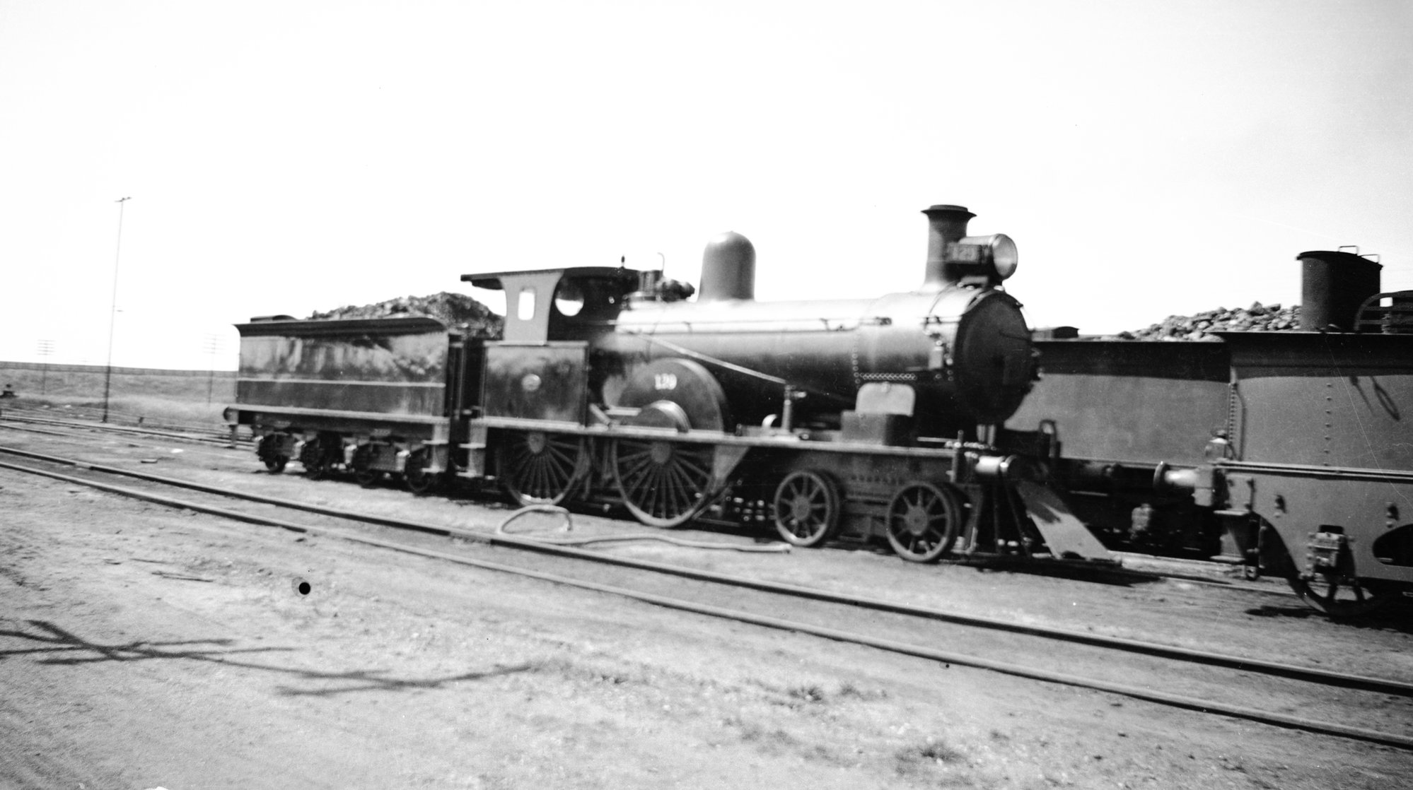 SAR S Class locomotive, no. 129, and tender, unidentified location, [n ...