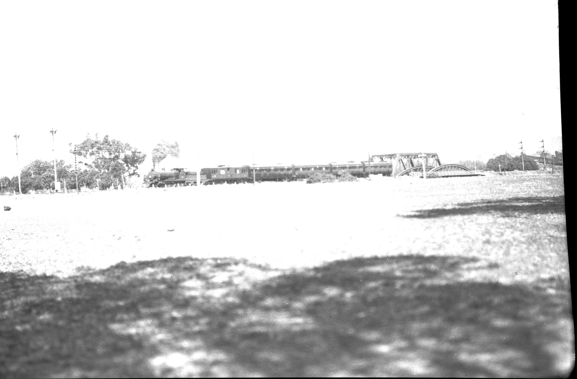 SAR Rx Class locomotive, hauling passenger train across steel bridge ...