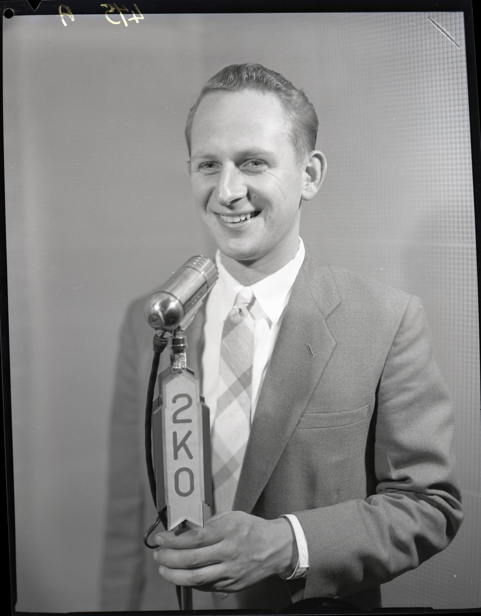 Mr Ron Hurst, 2KO radio announcer smiling at the camera, Kotara, 1957 ...