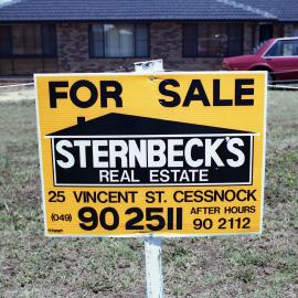 Sternbeck's "For Sale" sign outside a house at [Millfield], NSW, February 1986