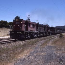 4834 and two 48 Class, goods train, Marrangaroo, NSW, 7 January 1986