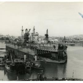 HMAS Hobart in dock, 22 February 1955  - State Dockyard, Newcastle, NSW,