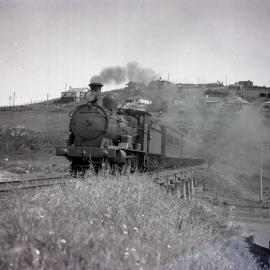 NSWGR C32 Class, No. 3294, 4-6-0 Ten-wheeler Type, express passenger locomotive on Sydney-bound passenger approaching Bombo, South Coast NSW, [1930s]