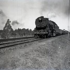 NSWGR D57 Class, No. 5719, Mountain Type, heavy goods locomotive on goods train near Ingleburn, [1930s]