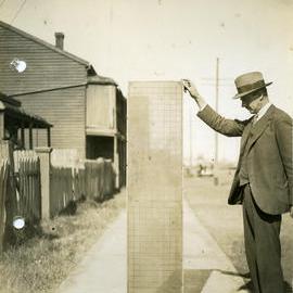 Unidentified man holding filter screen  -  Morison & Bearby Ltd, Newcastle, NSW, [n.d.]