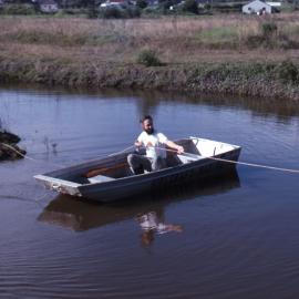Greg Baxter ferries plants to canoe trail island, Wetlands, Shortland, NSW, June 1989