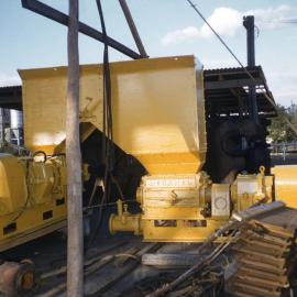 Markham stower on surface set at right angles with feed hopper. Arrangement permits feed from common belt delivery, August 1956