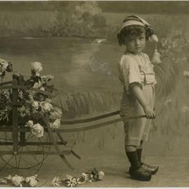 Child Pulling Cart of Flowers