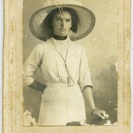 Portrait of an unidentified woman in wide-brimmed hat