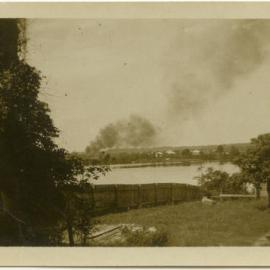 Photo of bushfire from across a river