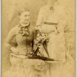 Carte de Visite of two unidentified women with flowers and umbrellas