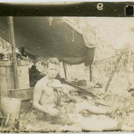 Photo of unknown soldier eating bread.