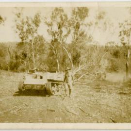 Man standing beside Bren Carrier, south of Darwin
