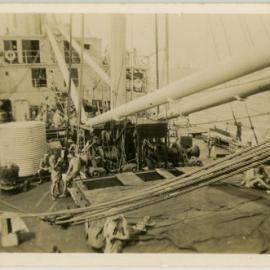 Photo of men aboard what is possibly a troopship