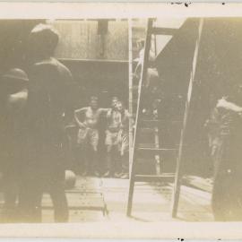 Men in the lower deck of a ship