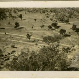 Photo overlooking dirt tracks, location unknown