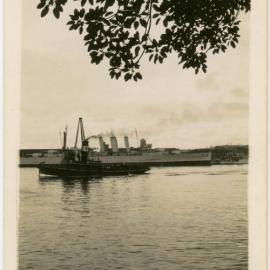 Unidentified large ship with tug in foreground, location unknown