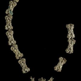 Ornate pieces of a broken masonic chain of office