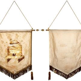 Lodge banner with gold print of beehive and bees