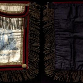 GUOOF Committee of Management, white apron with red and gold detail