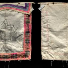 Apron, GUOOF, tartan trim and multicoloured flap