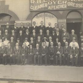 Group photo, Order of the Sons of Temperance in front of Mrs Rowan Fancy Goods, [Warrnambool, Vic]