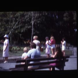 People on park bench, Newcastle, NSW, 1983