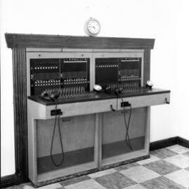 NESCA Exchange, telephone switchboard with clock, Newcastle, NSW, 1959
