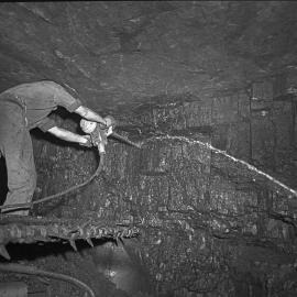 Miner drilling undergraound, Mount Sugarloaf Colliery, West Wallsend, NSW, 1959