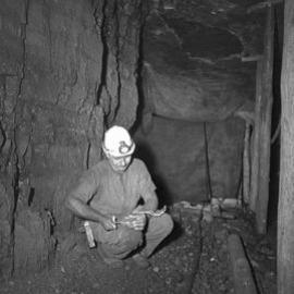 Miner underground, Mount Sugarloaf Colliery, West Wallsend, NSW, 1959