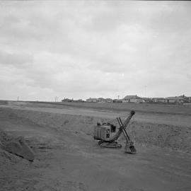 Crane on construction site for new Titan Manufacturing building, Mayfield, NSW, 1958
