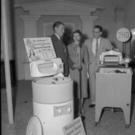 Mrs Evans, with a Westinghouse washing machine,  2HD Radio, 1958