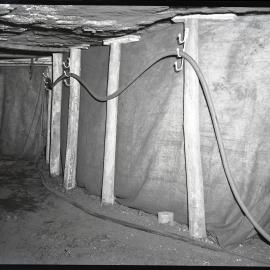 Underground coal mine with large cables and pit props, Burwood [No 3] Colliery, Whitebridge, NSW,  1957