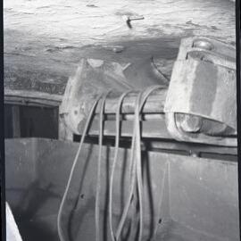 Cables on conveyer, underground in Burwood [No 3] Colliery, Whitebridge, NSW,  1957