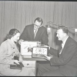 2HD Radio Station promotion showing woman with gift of Philips clock radio, Hamilton, NSW