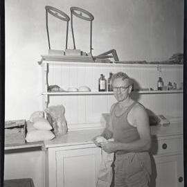 Man standing at workshop bench, [Wyee State Mine], NSW, 1962