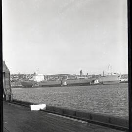 Ships on Newcastle Harbour, docking and loading, NSW, 1963 