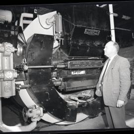 Singleton Dairy Co Op., man observing Hodgkinson Low Ram Stoker, 1963