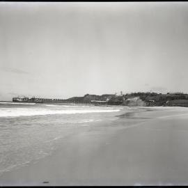 Beachside jetty with boats, 1963