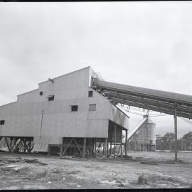 Factory building with three conveyor belts, 1963
