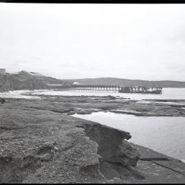 Boat jetty with factory in the background, 1963