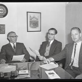 BMC Australia, three men at desk, 1963