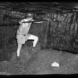 Miner in underground shaft